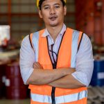 foreman or worker work at factory site check up machine or products in site